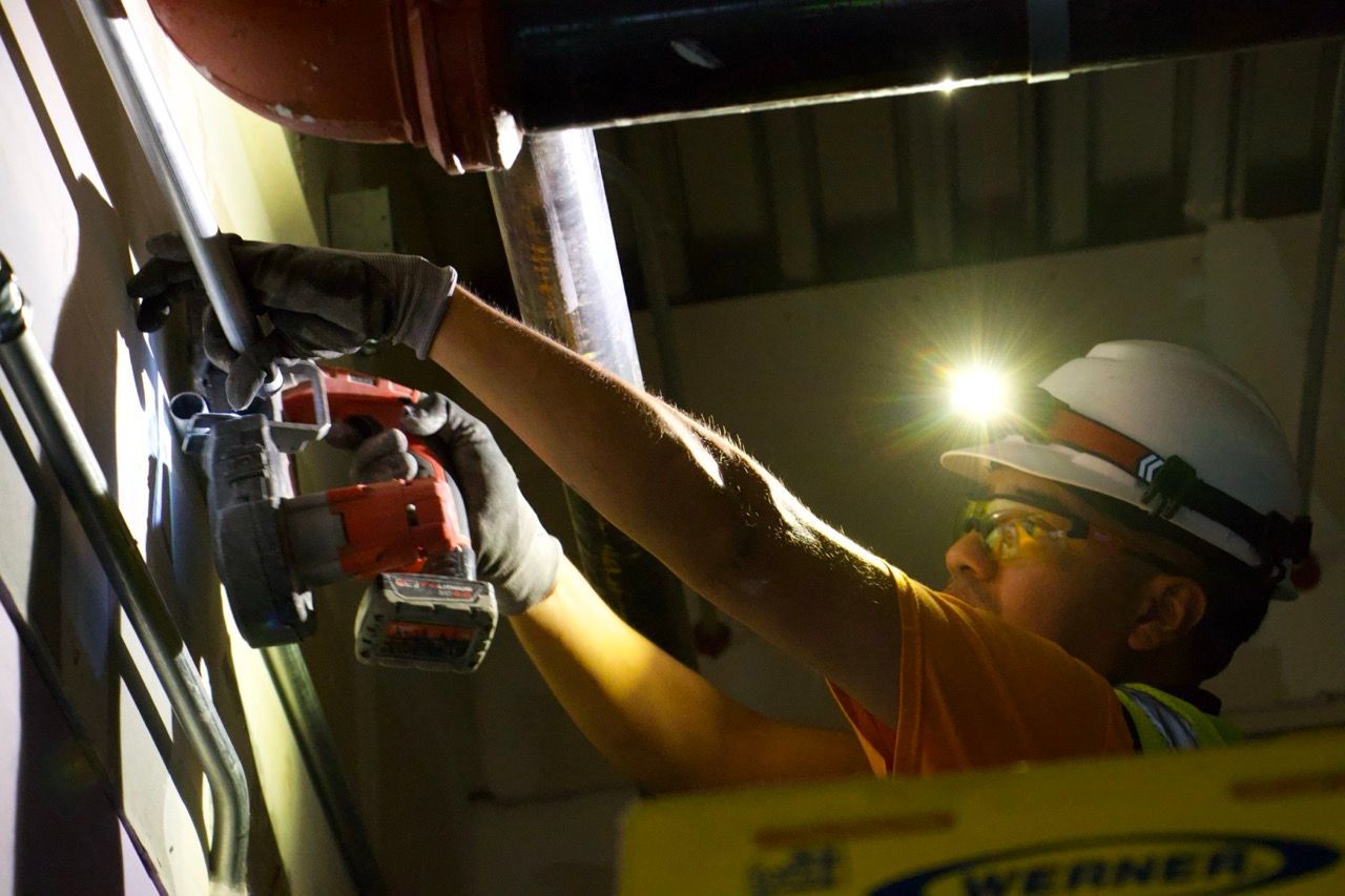 vine electric employee working on some detail for electrical project