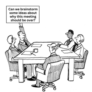 people sitting around a table with a sign that says can we brainstorm some ideas about why this meeting should be over