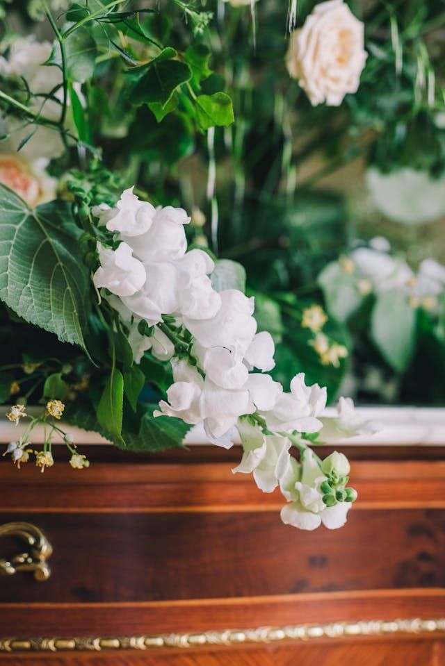 bringing flowers to a traditional funeral service