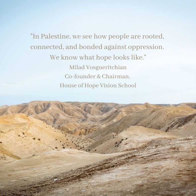 An image of hills in the desert of Palestine. Beige text overlaid on the blue sky says: