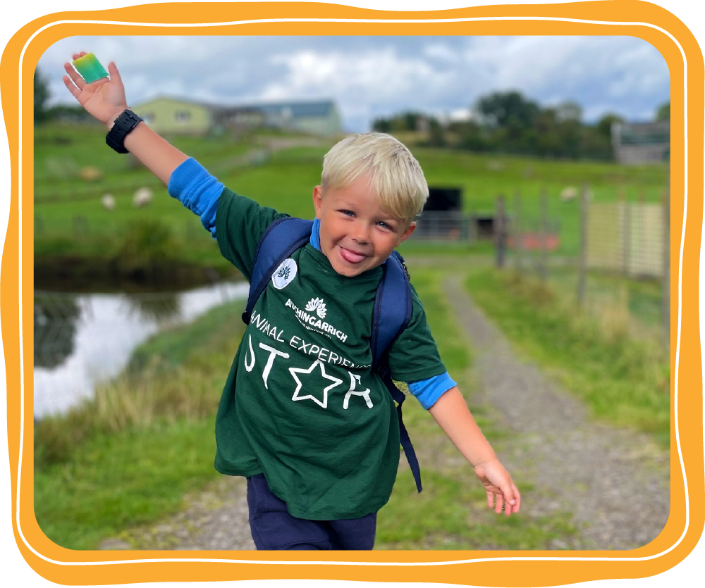 happy boy with an Animal Experiences tshirt on