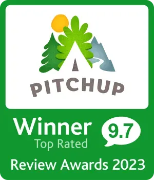 A green sign that says pitchup winner 9.7 top rated review awards 2023
