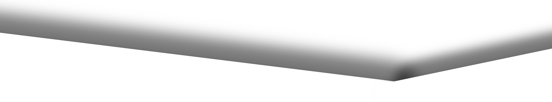 White folded paper airplane on a light gray background, shown close up from the side