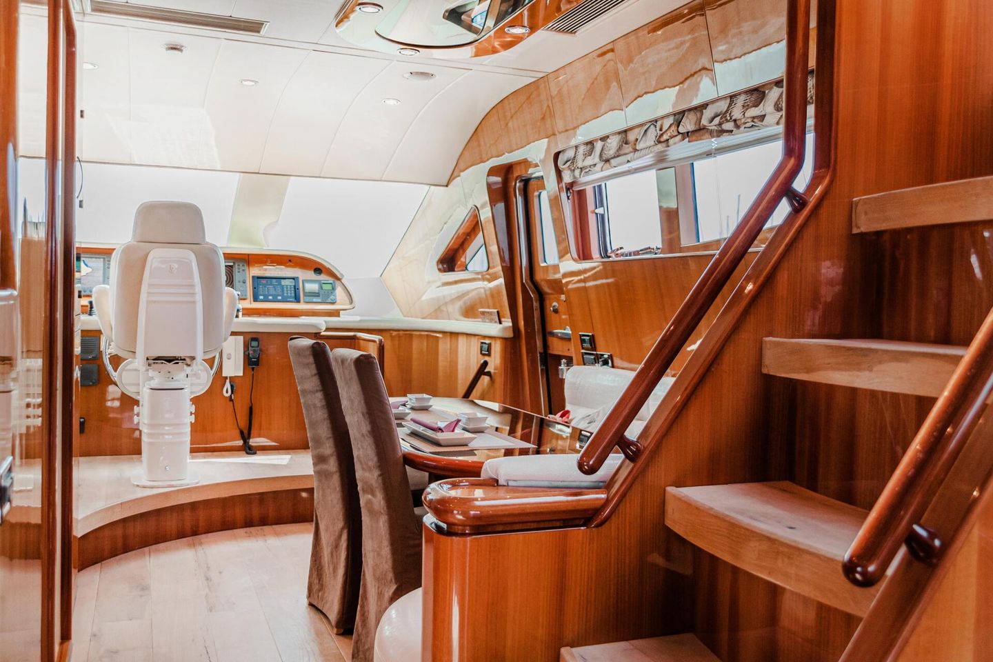 Interior of a luxury yacht with polished wood finishes and leather seats