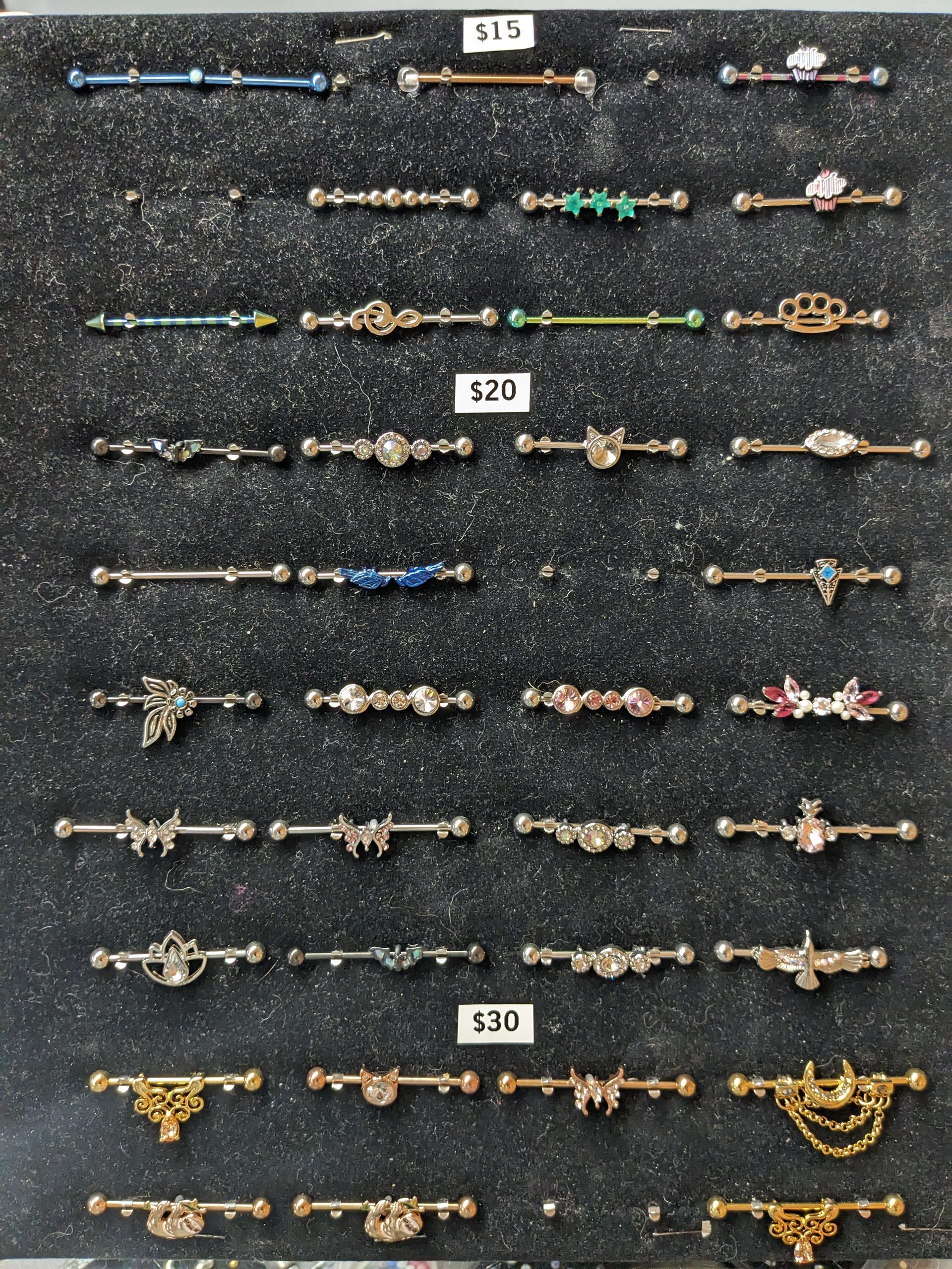 a display of piercings with one that costs $ 30