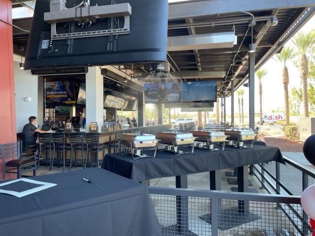 A restaurant with a lot of tables and buffets.