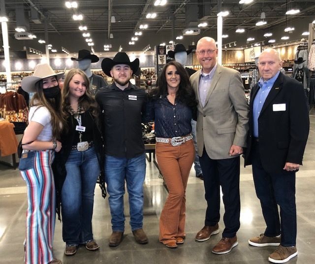 A group of people posing for a picture in a store