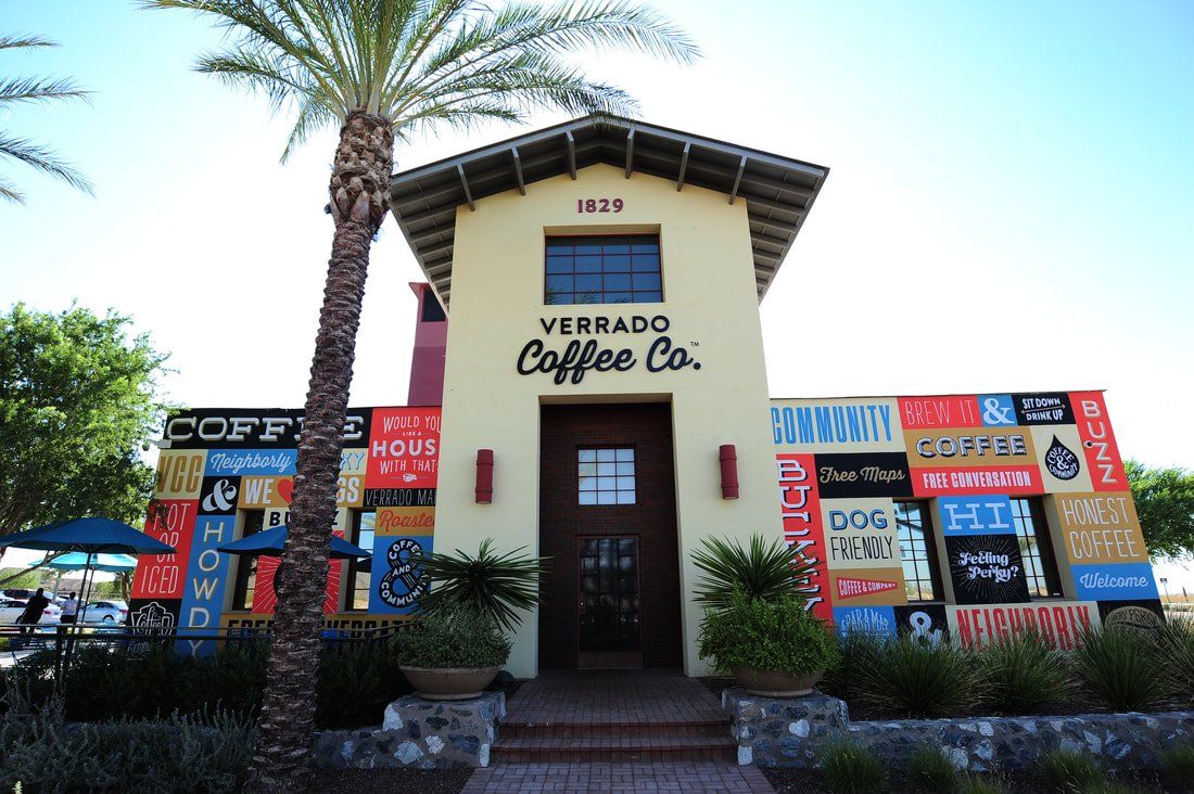Verado coffee co. is a small building with a palm tree in front of it