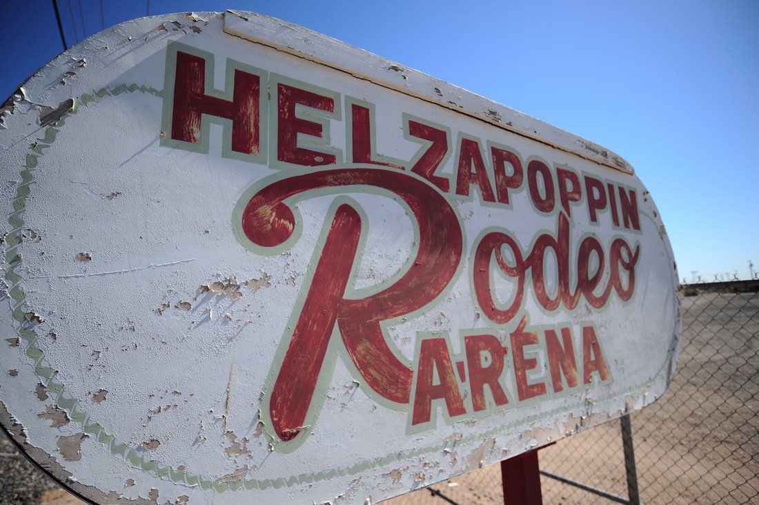 A sign for the hellzapoppin rodeo arena
