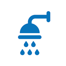 Blue shower head with water droplets.