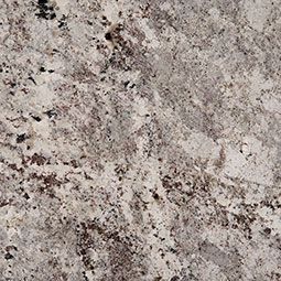 A close up of a white granite counter top.