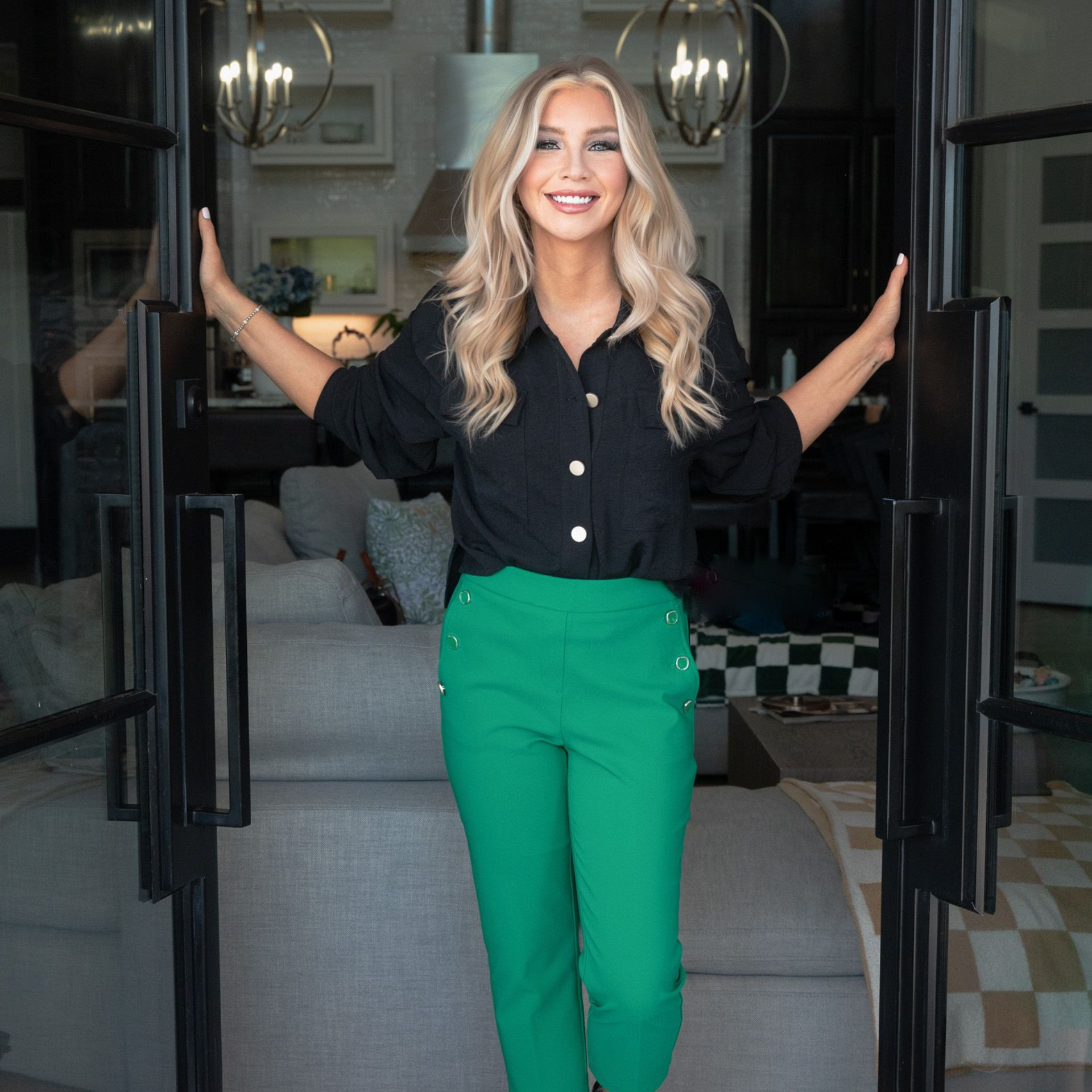 Laramie Hargrove Realtor: smiling, standing in doorway, arms open wide. Accepting New Clients.