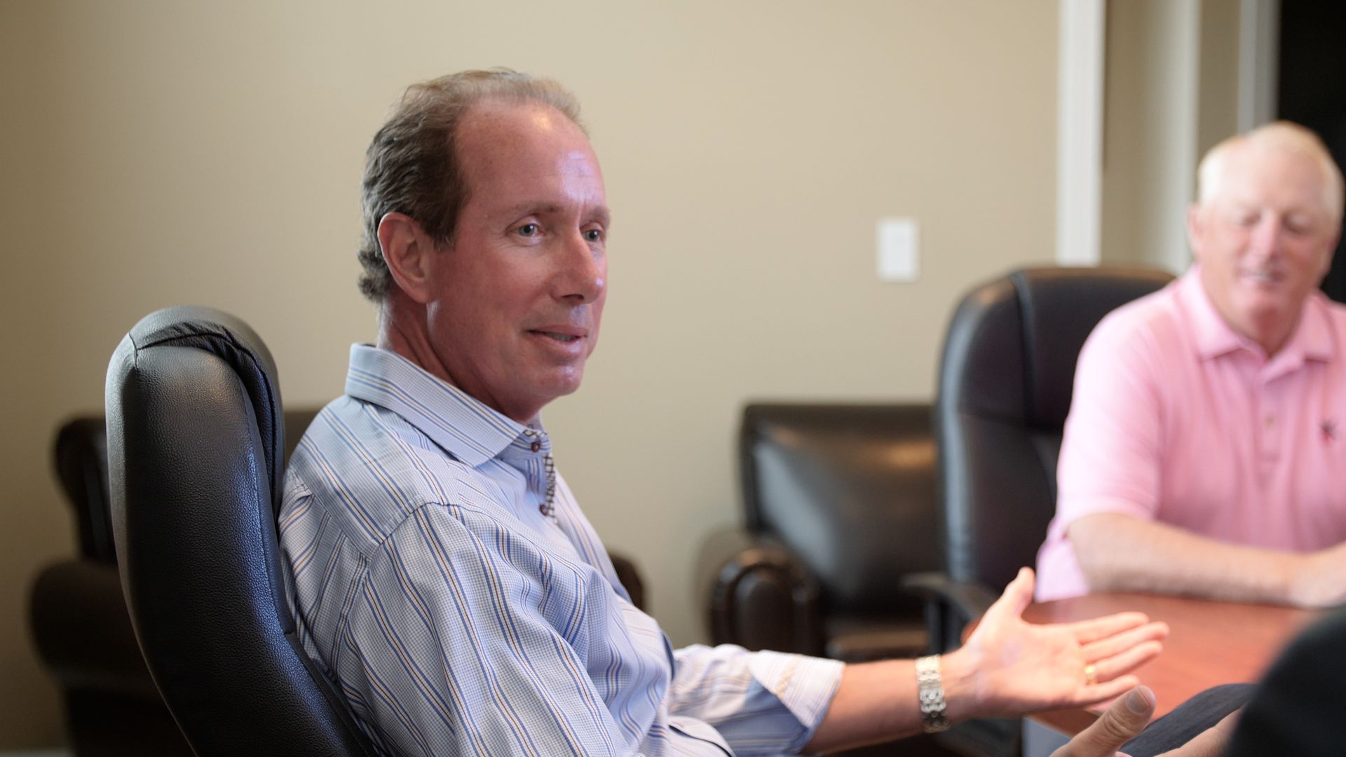 Dental business brokers talking at a table | consultants in GA and FL