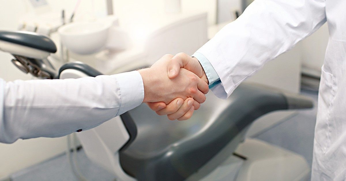 How to sell and dental practice | Top business brokers Business men shaking hands | Buying and selling dental businesses in AL FL GA and NC