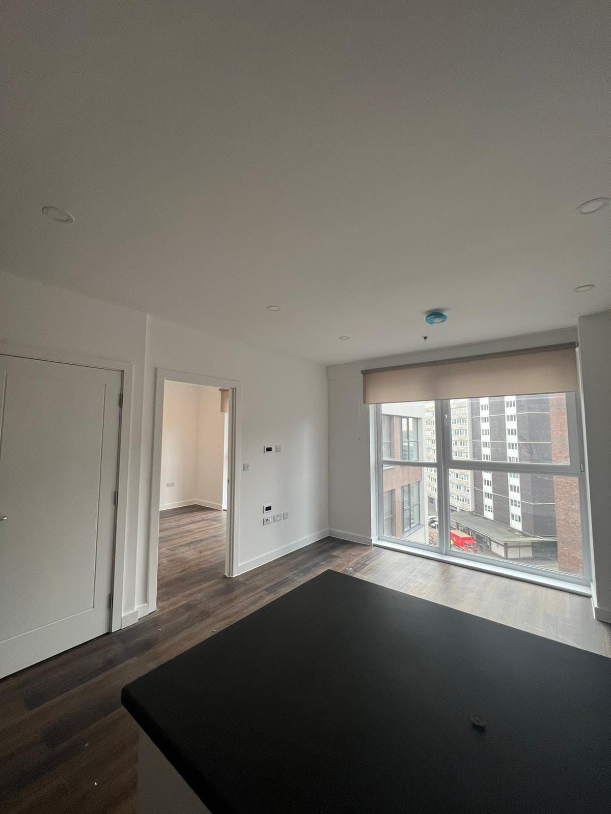 There is a large window in the middle of the room.