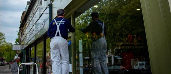 A large conference room with a table and chairs in it.