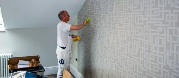 A long hallway with a colorful stripe on the wall
