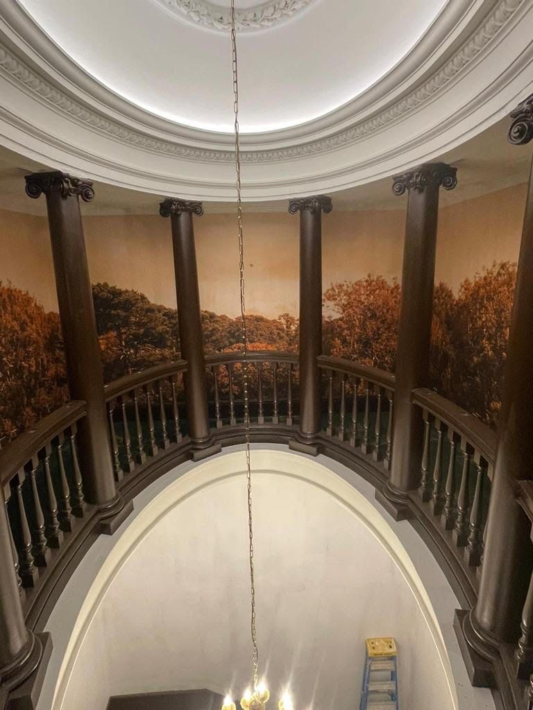 A chandelier is hanging from the ceiling of a building.