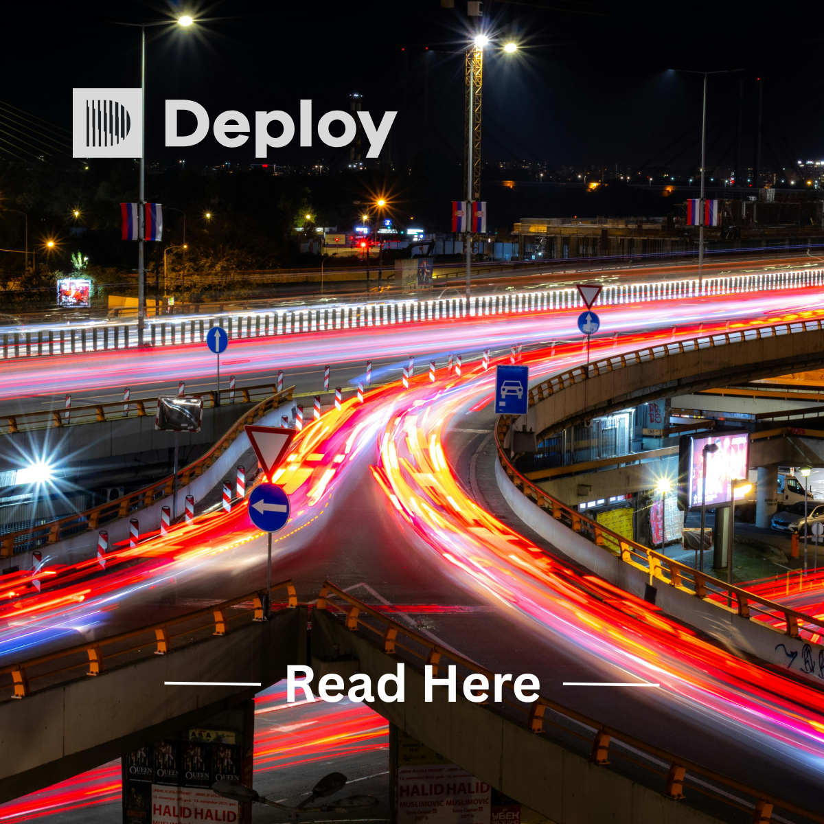 Nighttime highway with blurred car lights flowing through overpasses; Deploy logo at the top,