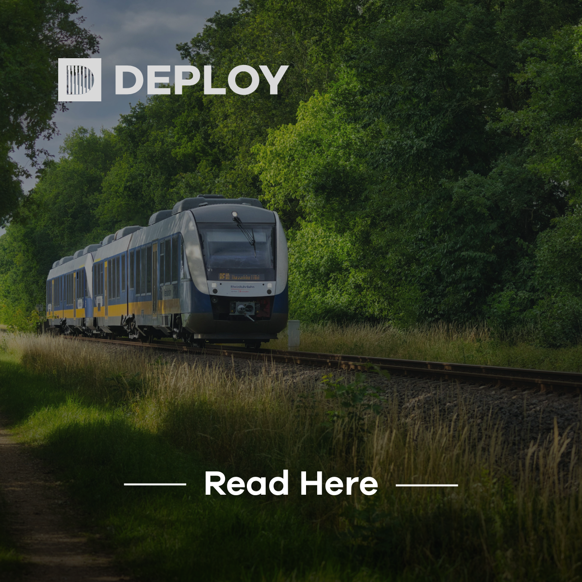 A train travels along tracks through a lush forest, with the text