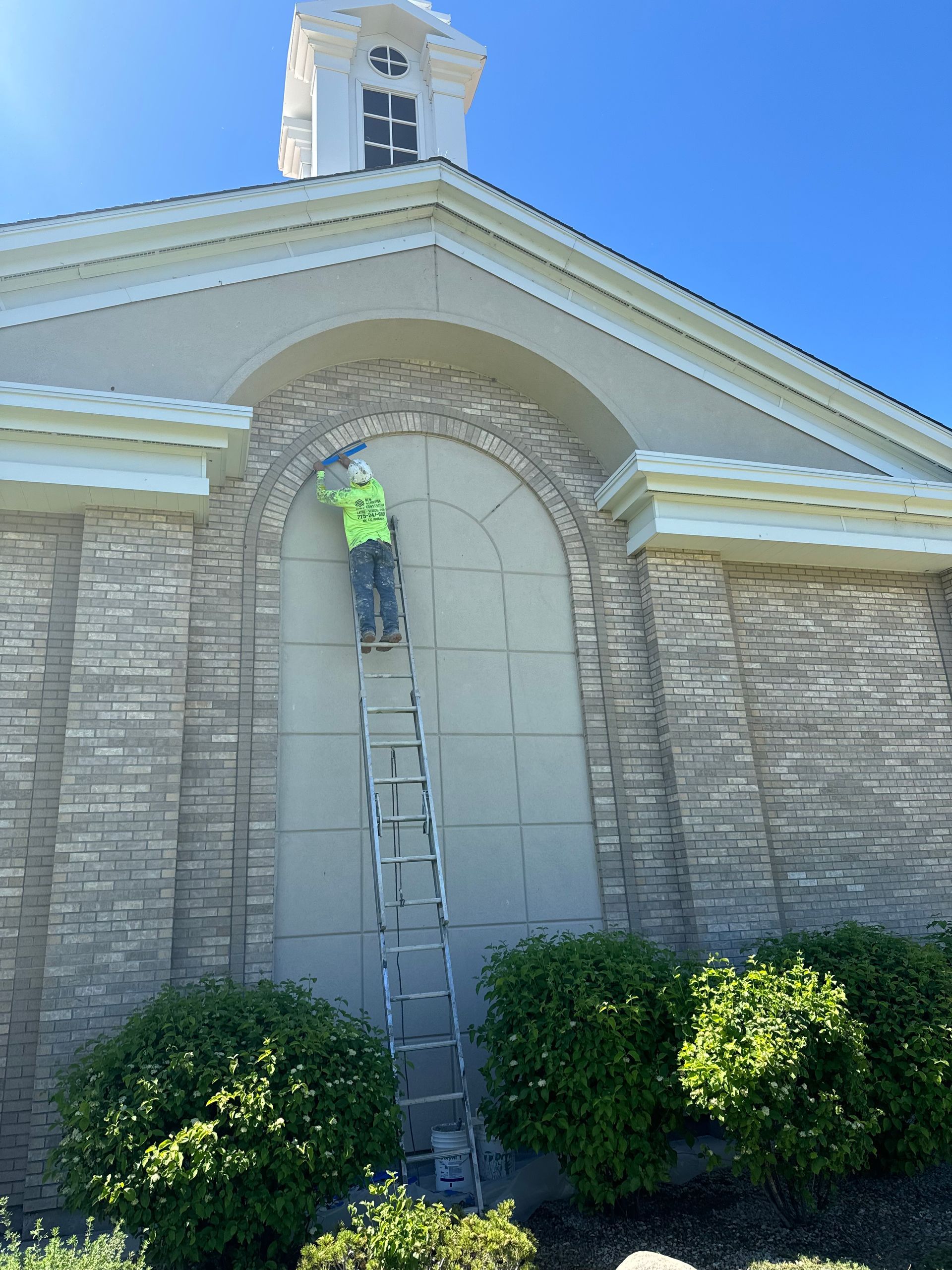 A stucco contractor is repairing stucco on a building in Reno, Nevada.