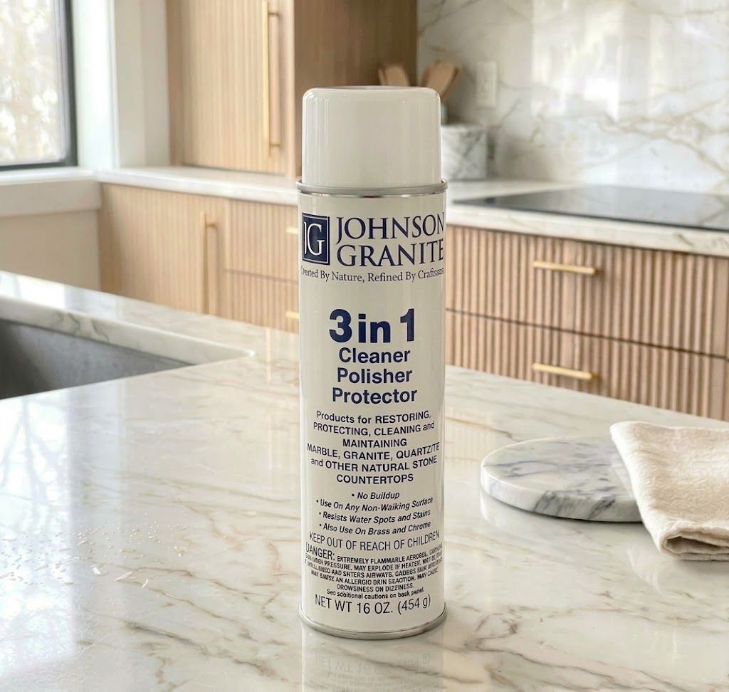 Johnson Granite 3-in-1 cleaner, conditioner and polish spray on a light marble kitchen countertop