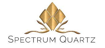 Spectrum Quartz logo with gold geometric crystal and stylized branch above the name