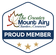 Greater Mount Airy Chamber of Commerce proud member logo with stars and autumn leaves