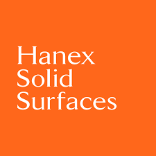 Orange square logo with white text reading “Hanex Solid Surfaces”