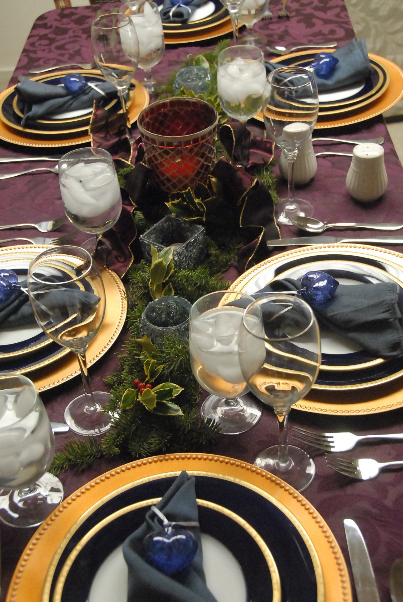 A table topped with a variety of food and flowers.