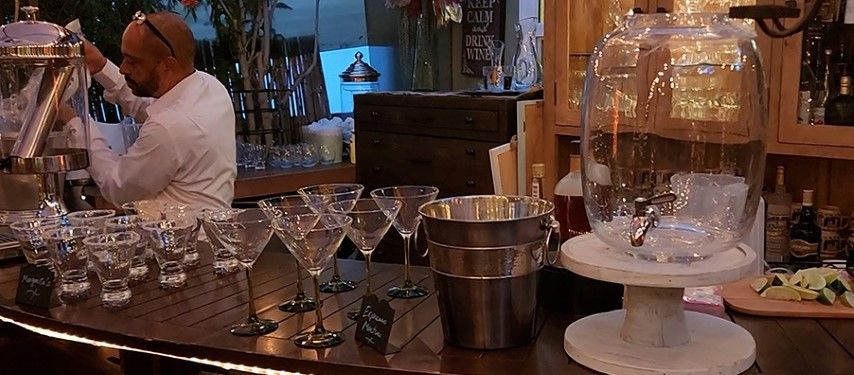 Setting up a margarita and special cocktail bar for an event in bexx secret garden.