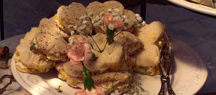 up close tea sandwiches with fresh flowers in bexx secret garden