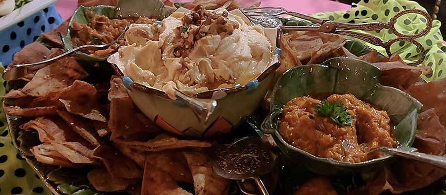 Mediterranean platter with house-made zaatar pita chips  with hummus and eggplant dip. bexx secret garden