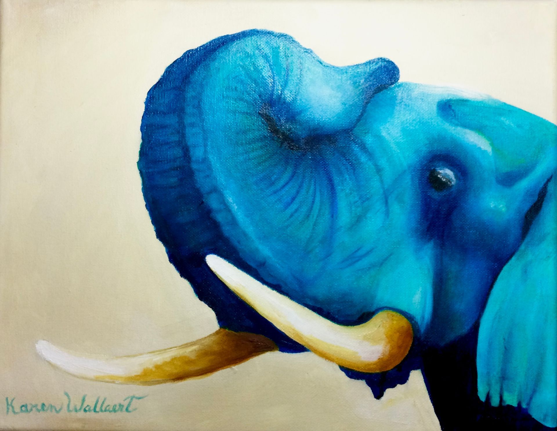 Blue elephant raising its trunk, ivory tusks, against a beige background.