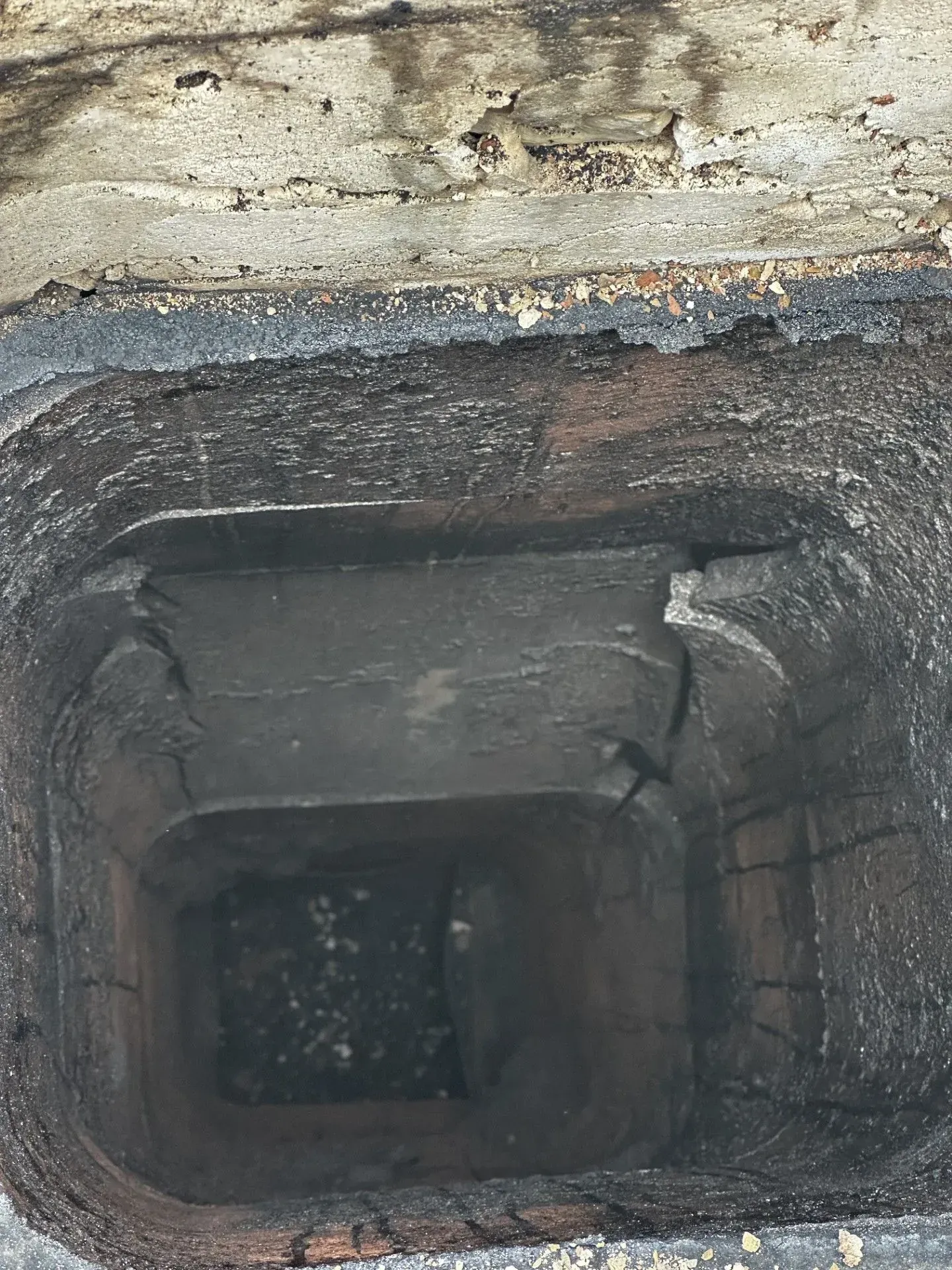 A manhole cover with a hole in the middle of it.