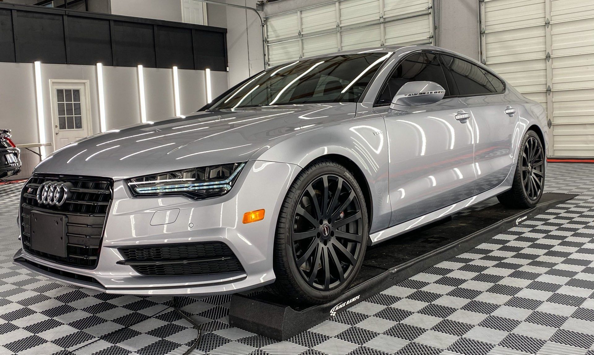 a ceramic coated car in an auto detailing shop