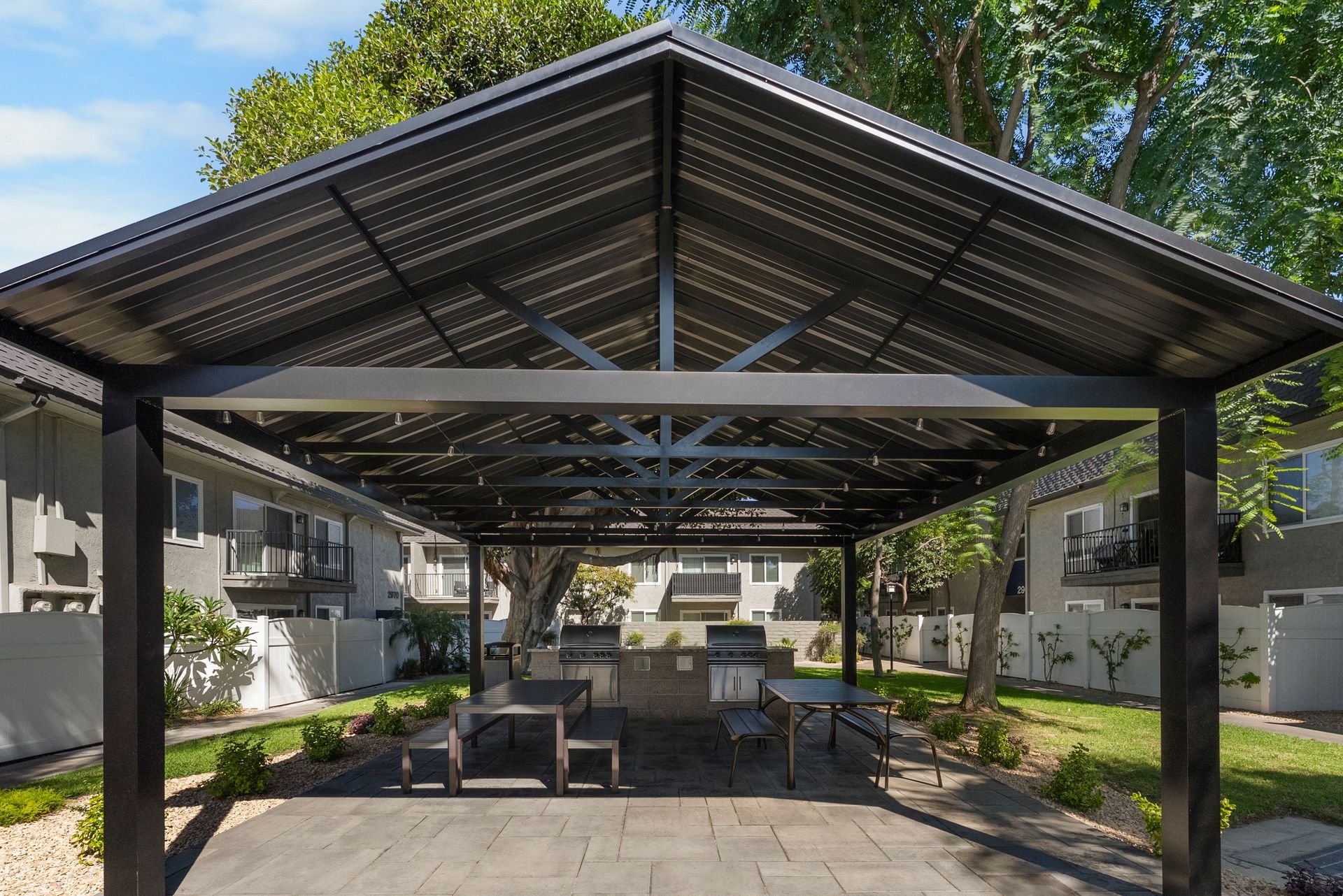 covered picnic tables and BBQ grills