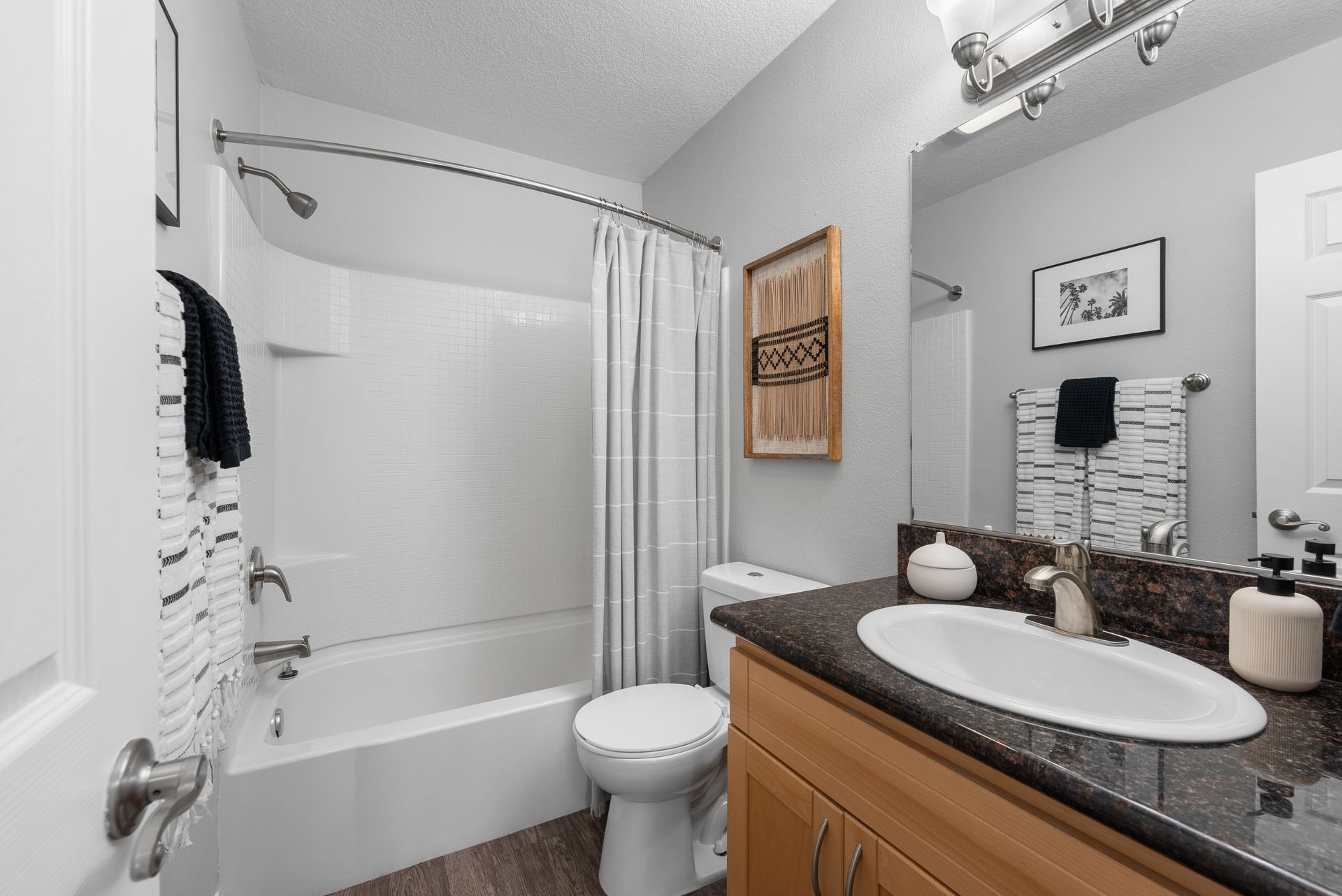 bathroom with sink, toilet, and shower tub