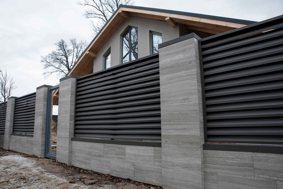 Newly built concrete and metal fence