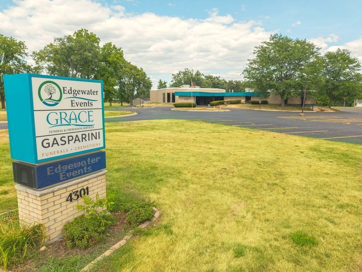 Single-story beige brick Grace Funeral & Cremation Services building with teal canopy entrance in Rockford, Illinois