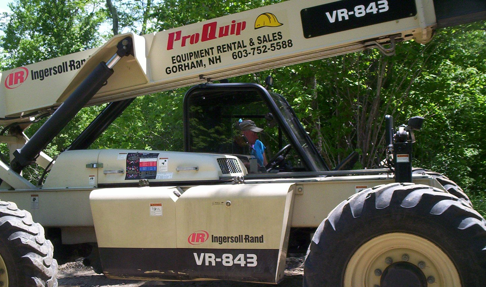 Off-road buggy with ProBilt branding in a wooded setting, beige body and large tires