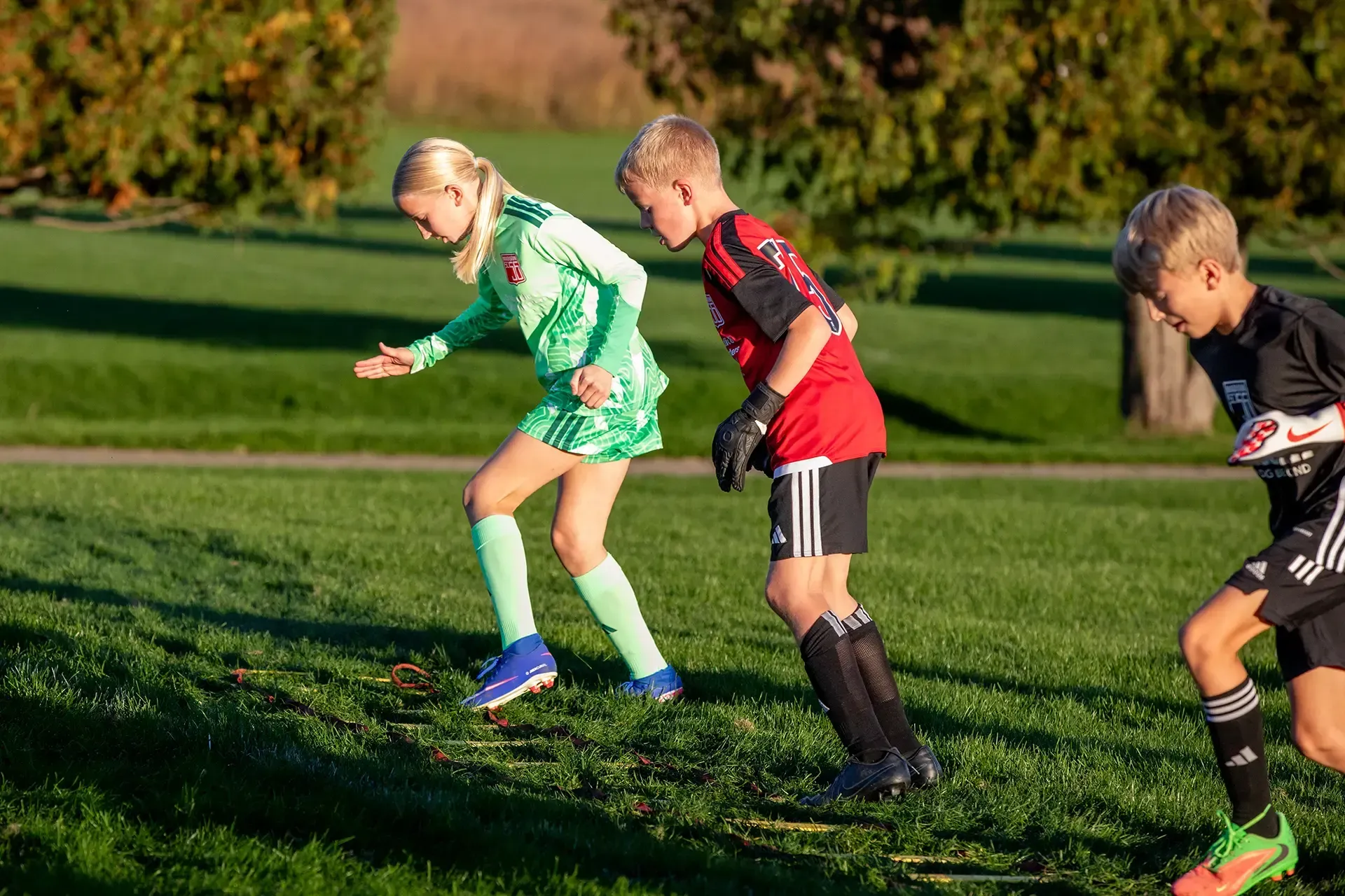Coach working one-on-one with a young player