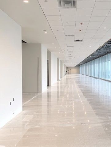 Modern Hialeah, FL office corridor with unfinished ceiling and white interior