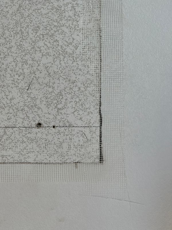 repaired wall with mesh tape