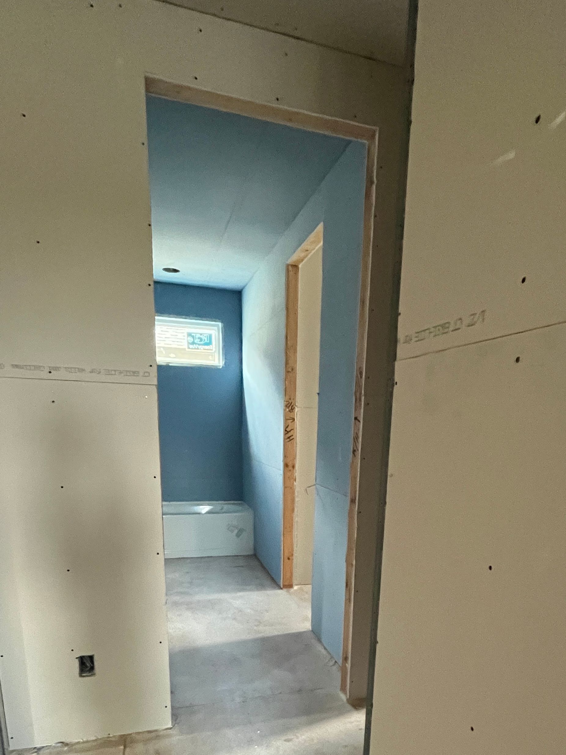 green board hung in a new bathroom