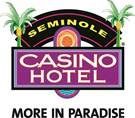 The logo for the seminole casino hotel is purple and has palm trees on it.