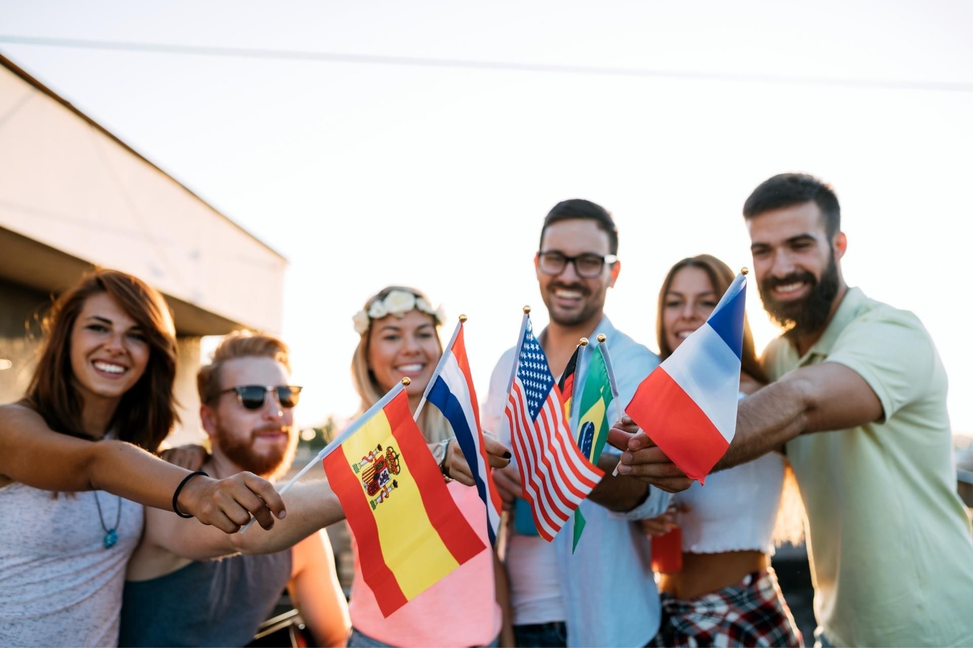 A group of people are holding flags of different countries.