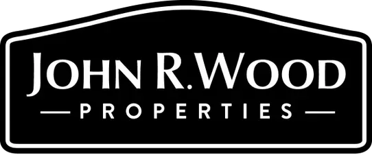 A black and white logo for john r. wood properties.