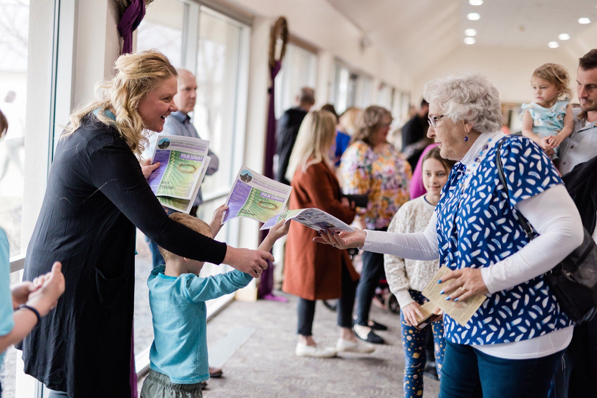 Passing out church bulletins