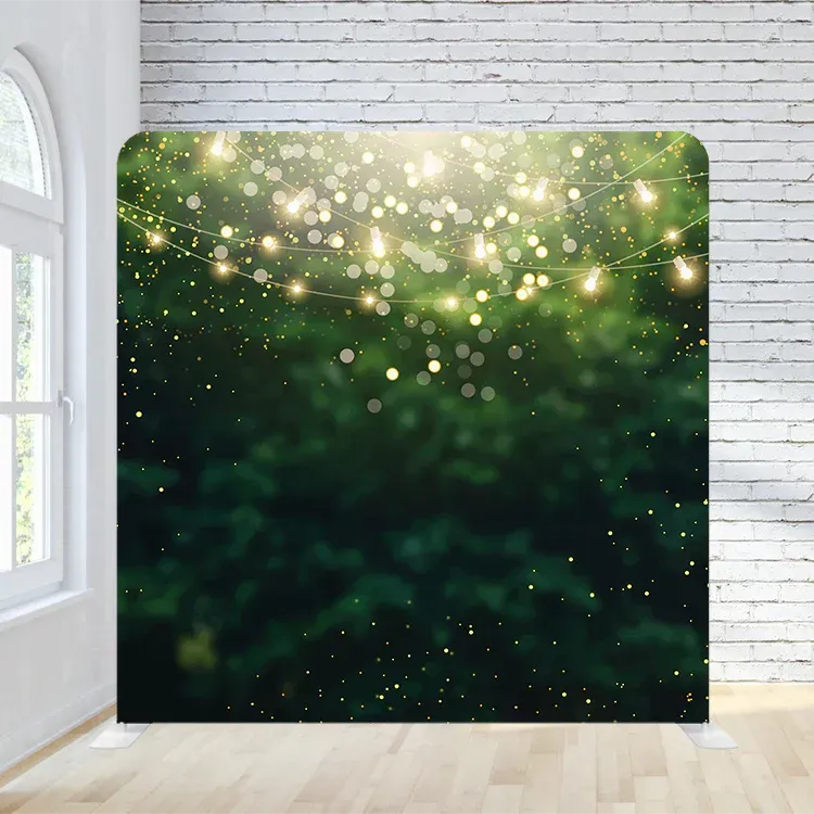 A room with a brick wall and a green background with lights hanging from the ceiling.